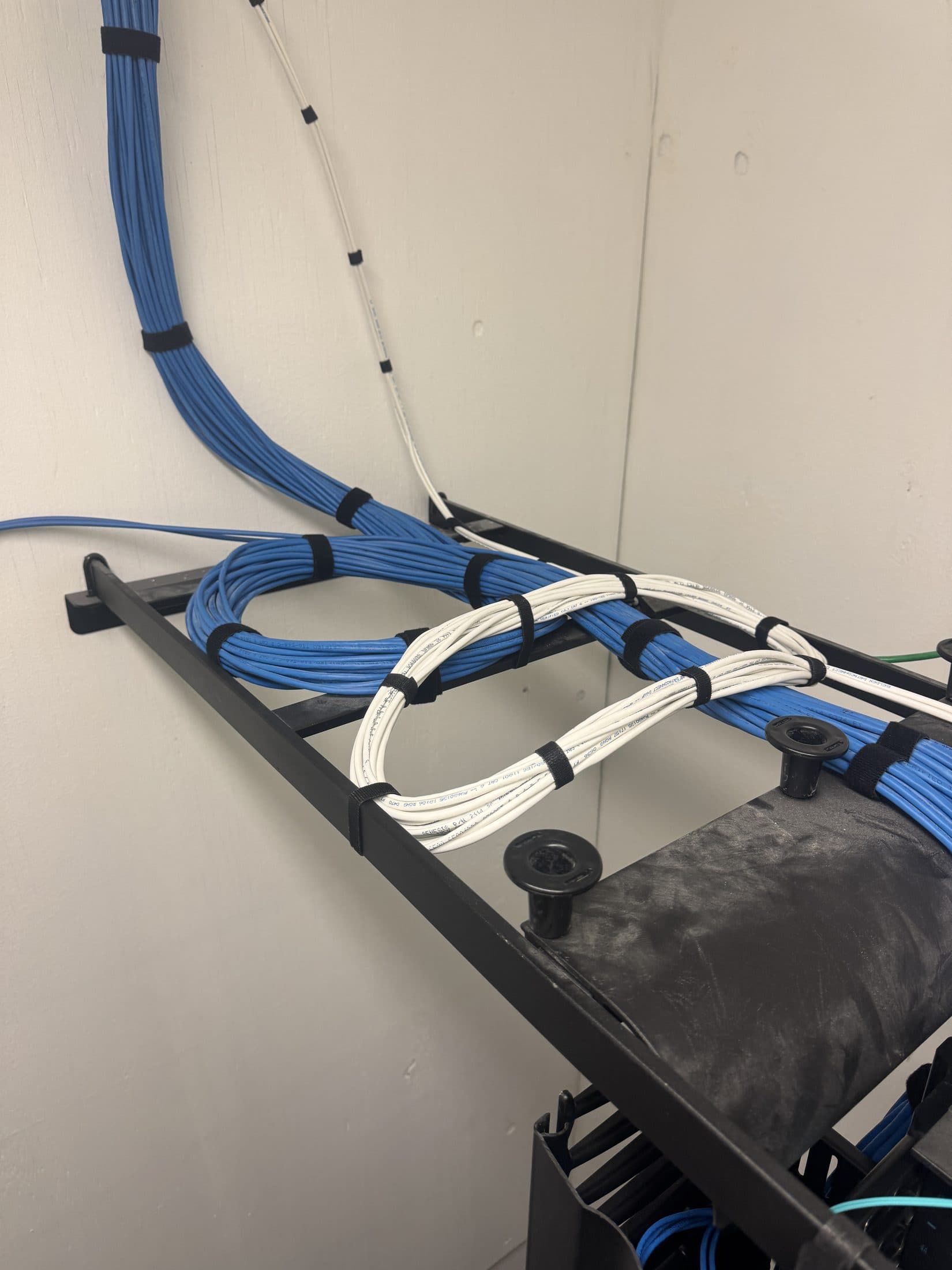Structured cabling routed and bundled in a commercial network rack