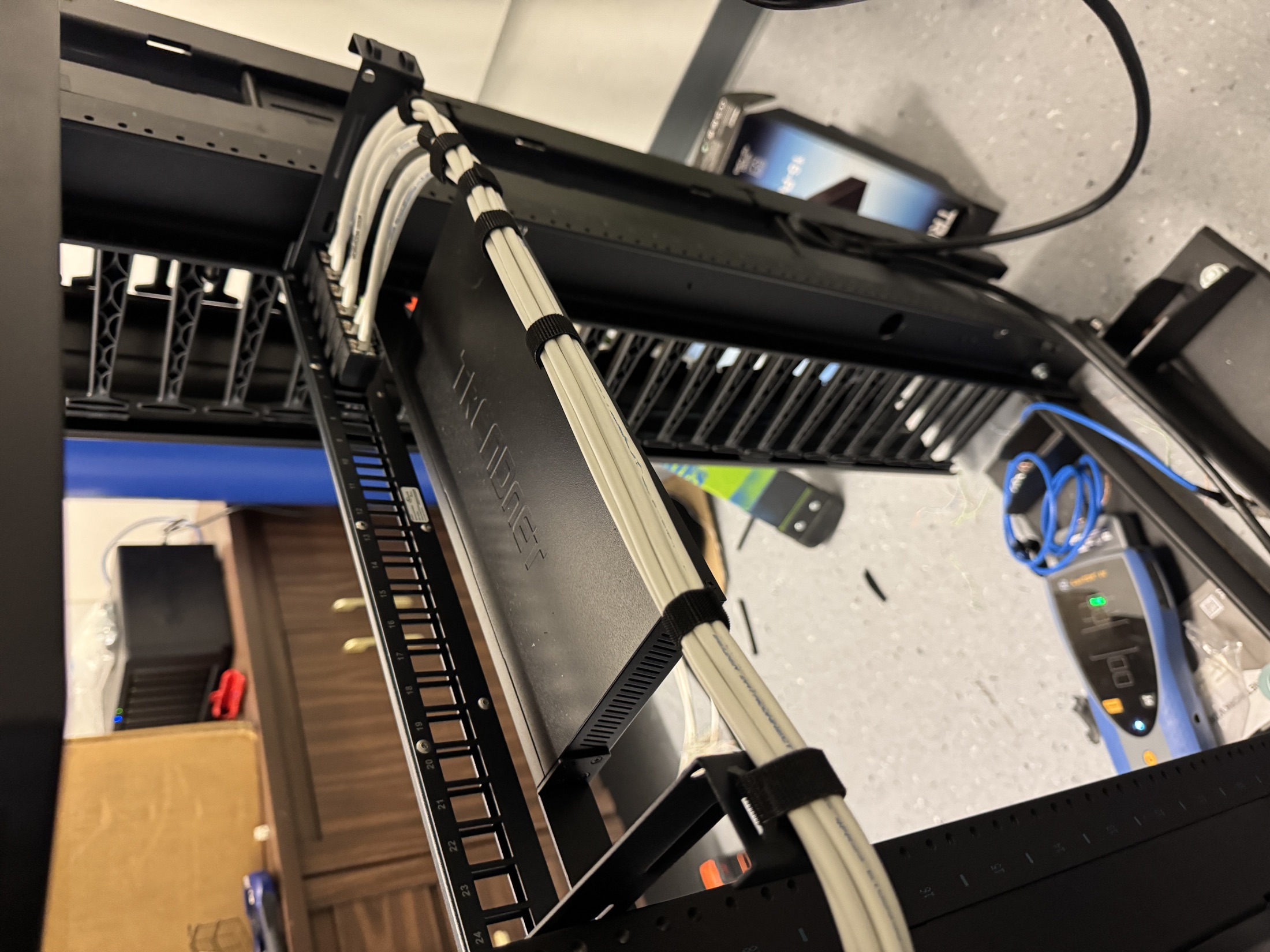 Structured cabling work inside a commercial low-voltage rack