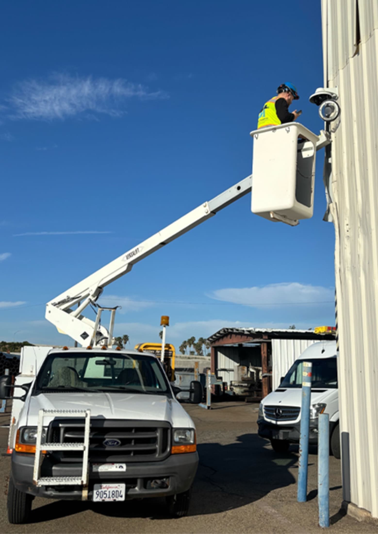 Commercial camera installation from a bucket lift