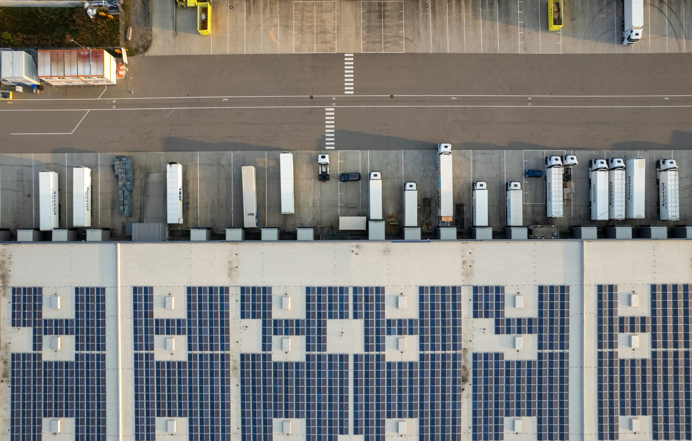 Aerial view of a commercial logistics yard with trailers and outdoor assets