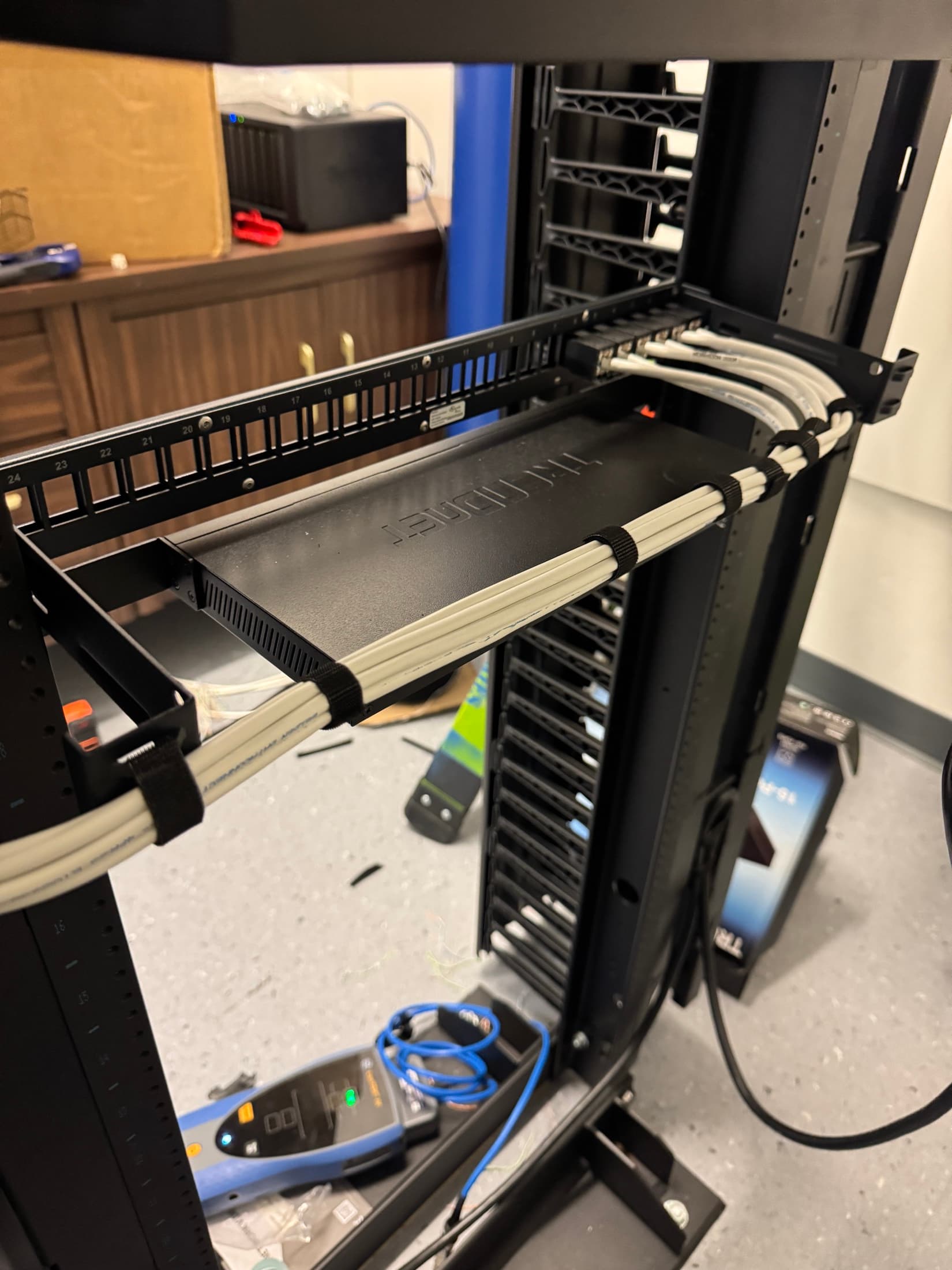 Cleanly installed low-voltage cabling inside a commercial network rack