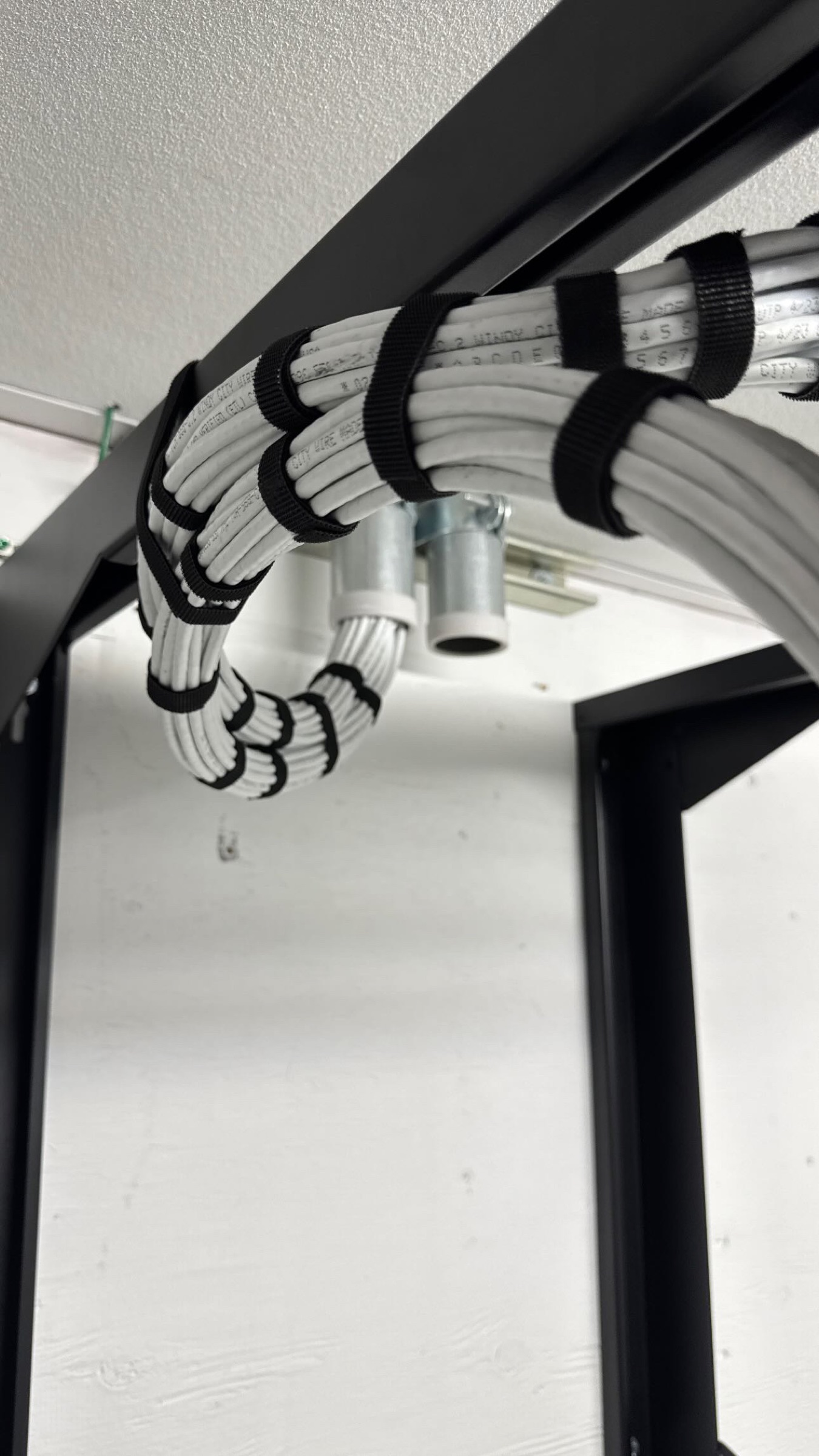 Organized structured cabling bundled through a commercial low-voltage rack