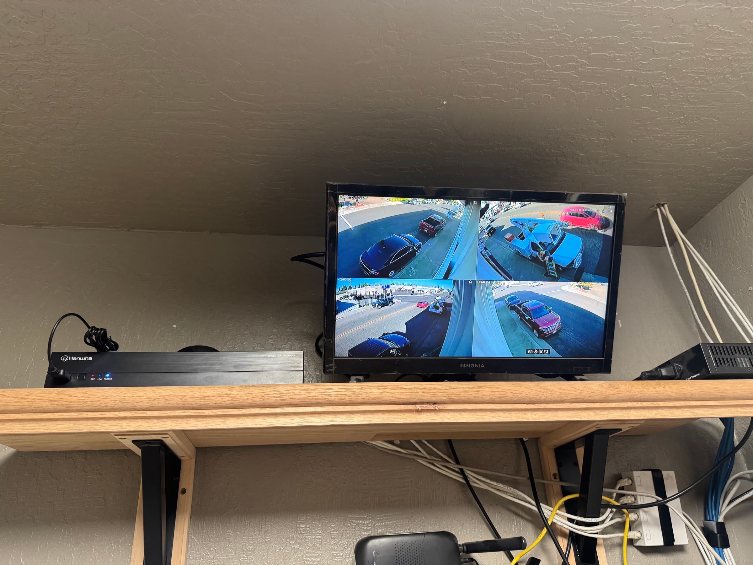 Live commercial camera views covering a parking area and business perimeter