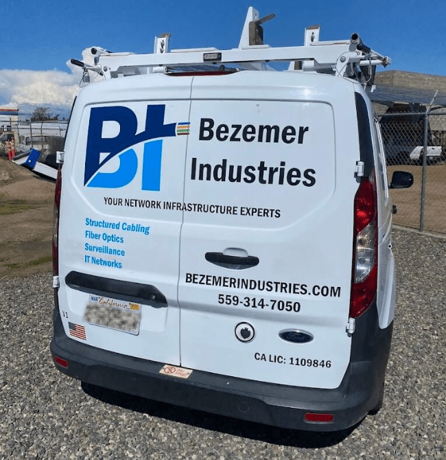 Bezemer Industries branded work van at a commercial site