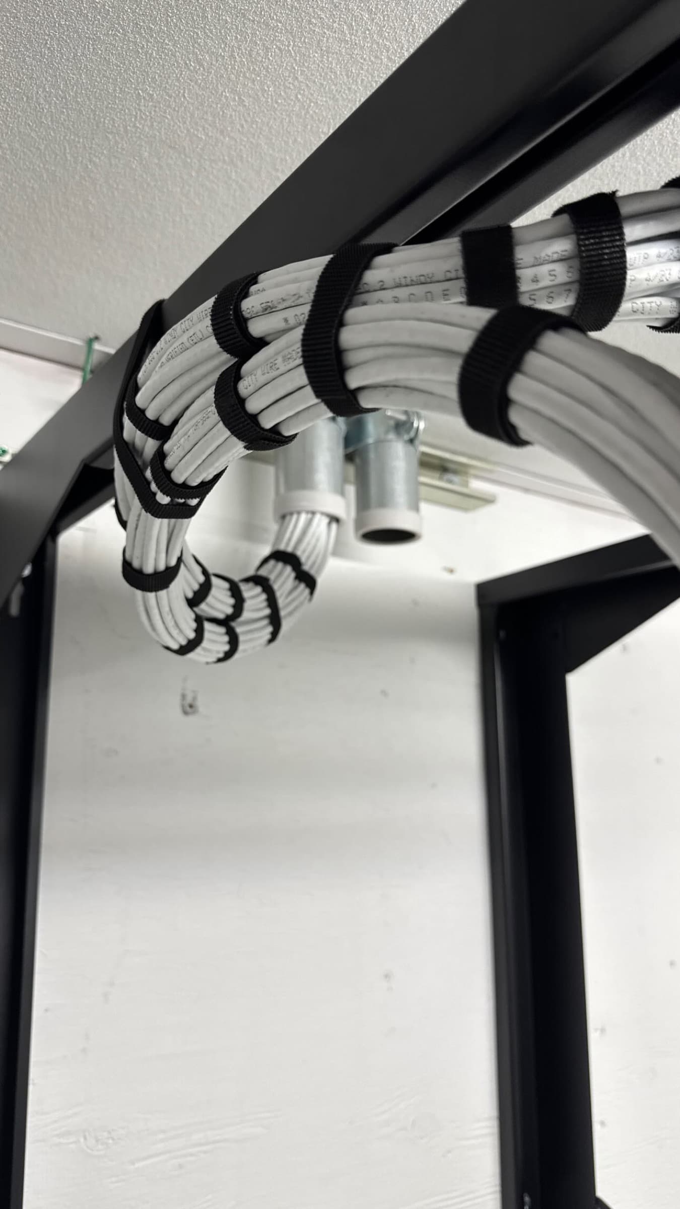 Organized structured cabling bundled through a commercial low-voltage rack